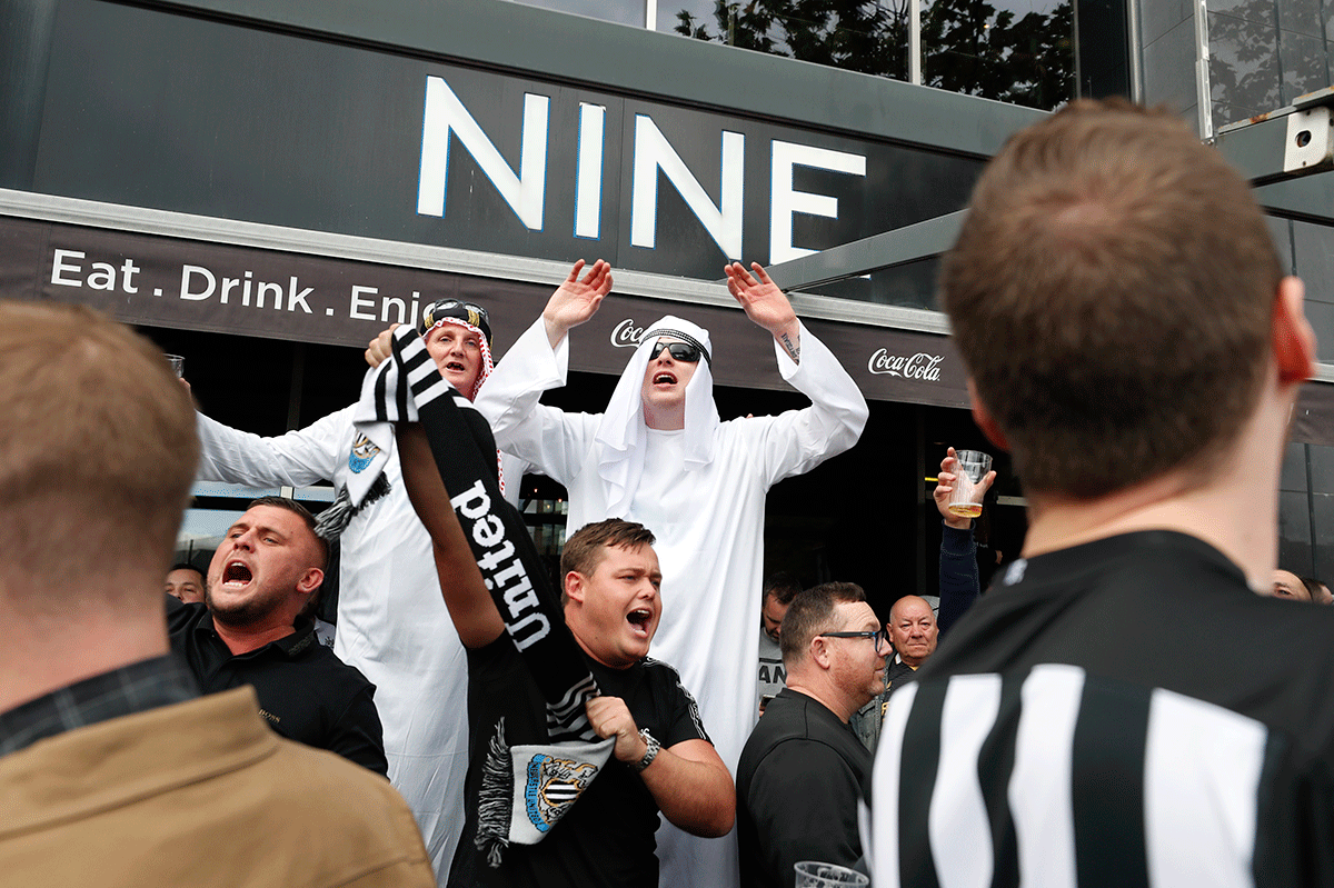 Newcastle United fans in the Nine Sports Bar and Lounge outside the St James' Park stadium before the match between Newcastle United and Tottenham Hotspur on Sunday, October 17. A number of supporters turned up in robes and head coverings for the home clash against Tottenham Hotspur at the weekend, the first game since the club was taken over by a Saudi Arabia-led consortium.