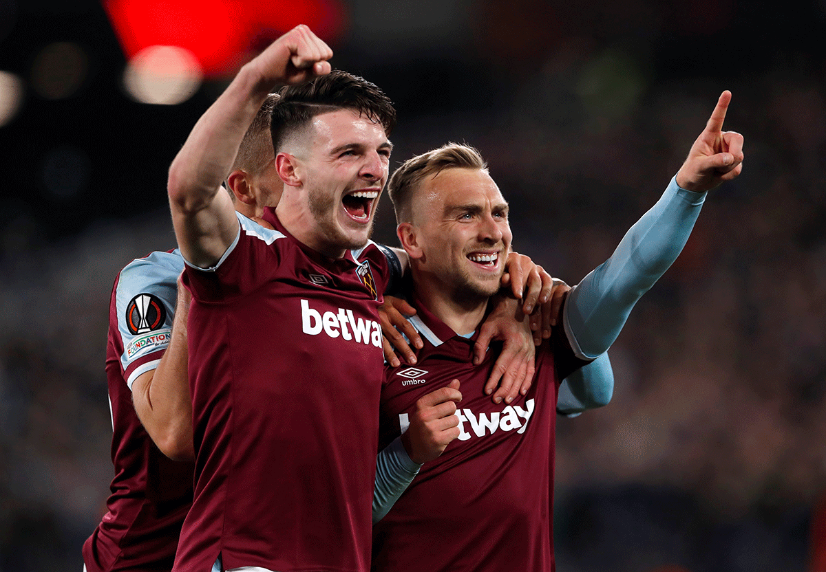 West Ham United's Jarrod Bowen celebrates with Declan Rice on scoring their third goal against KRC Genk at London Stadium in London on Thursday 