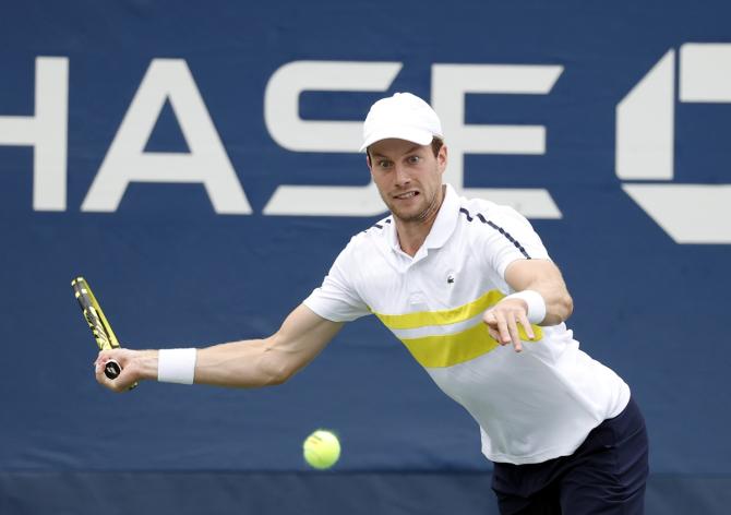 Botic Van De Zandschulp of The Netherlands hits a forehand against Norway's Casper Ruud.