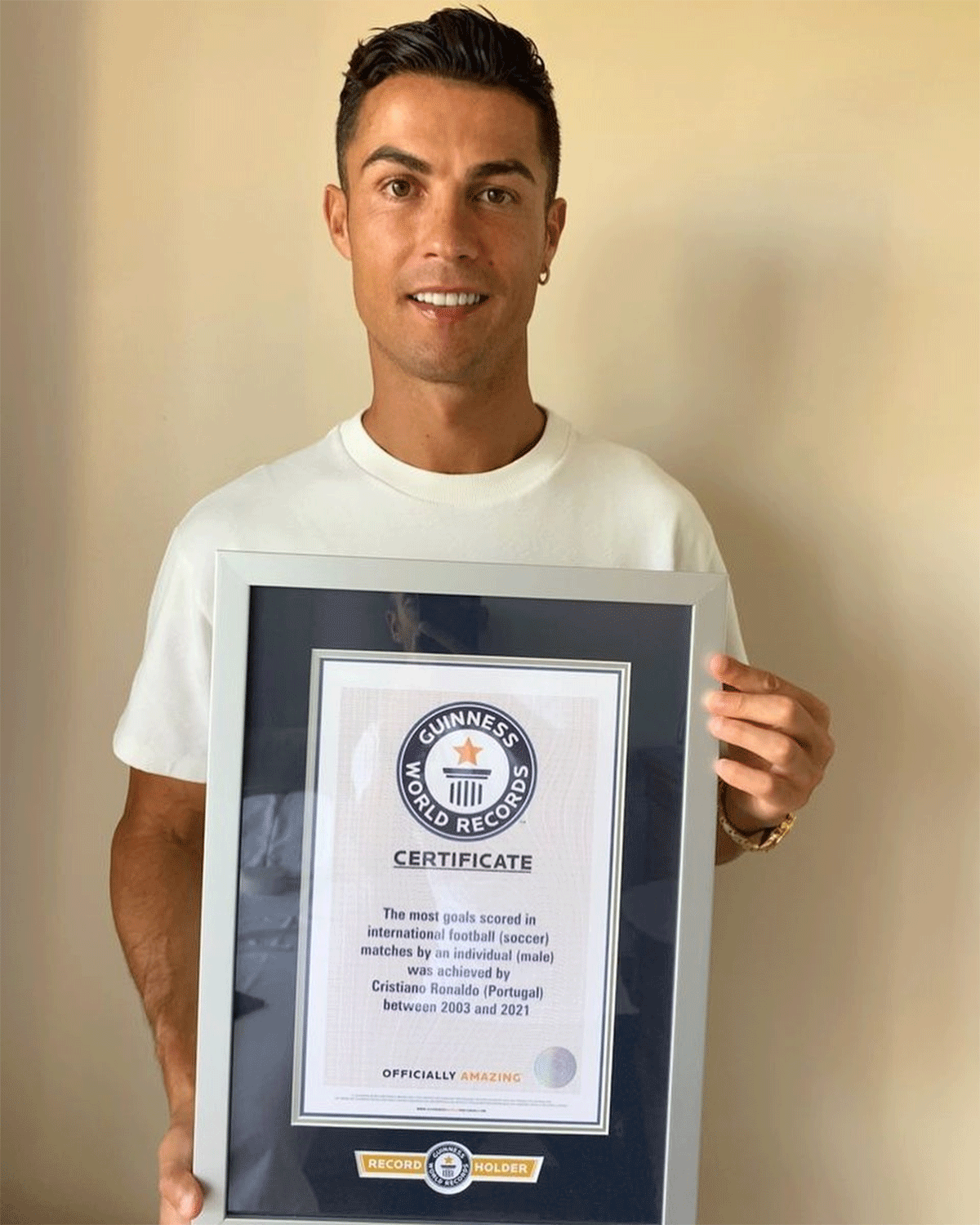 Cristiano Ronaldo with a certificate from the Guiness World Records for scoring most goals in international football, a feat he recorded against Ireland on Wednesday
