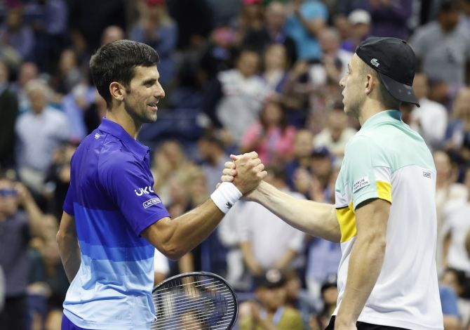 Novak Djokovic, left, shakes hands with Tallon Griekspoor after their second round match.