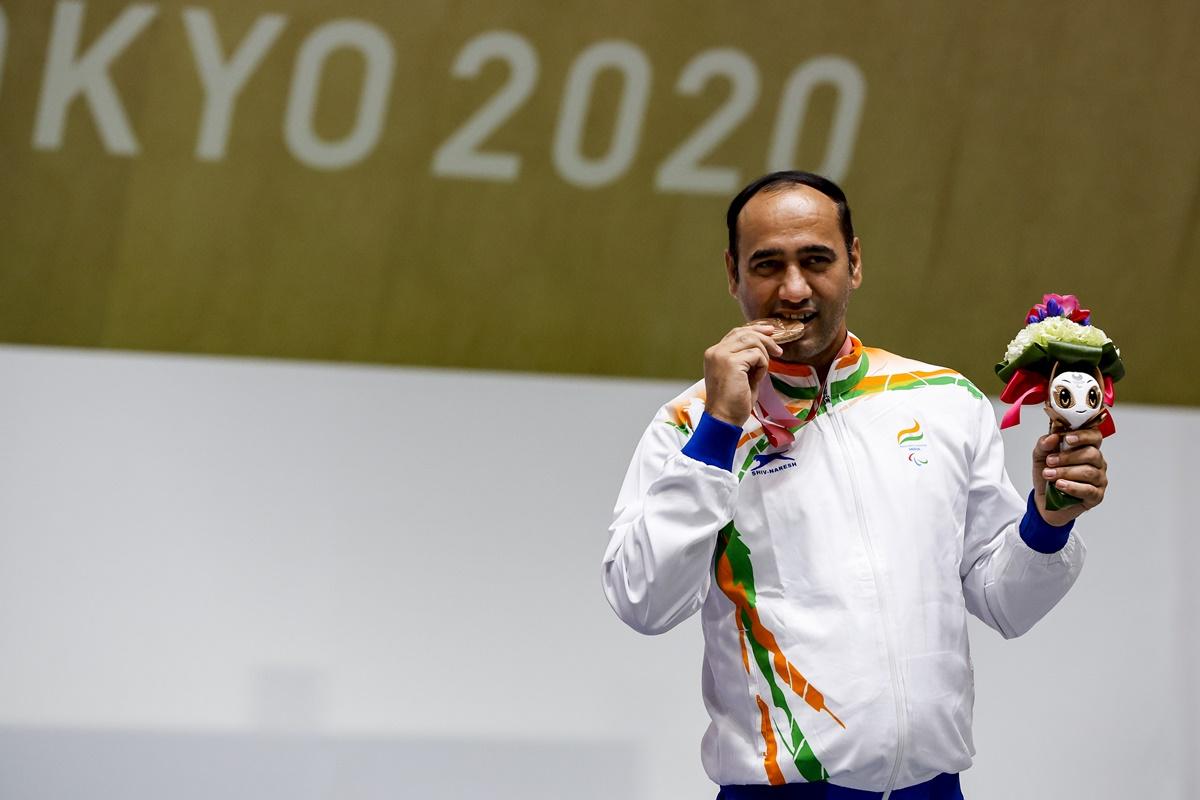 India's Singhraj Adana poses with his bronze medal from the P1 men's 10m Air Pistol SH1 event.