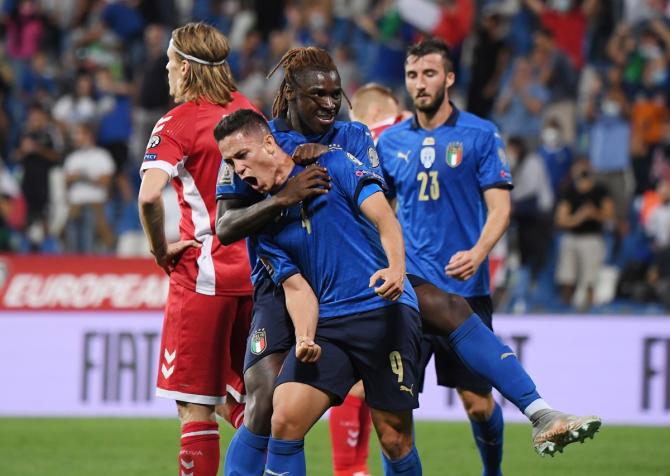 Giacomo Raspadori celebrates scoring Italy's third goal with Moise Kean during the UEFA Group C qualifier against Lithuania