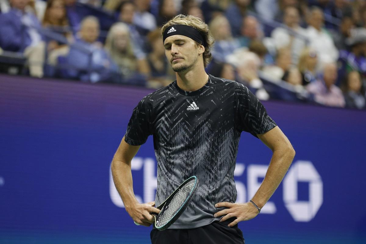 Alexander Zverev reacts after missing an easy return against Novak Djokovic.