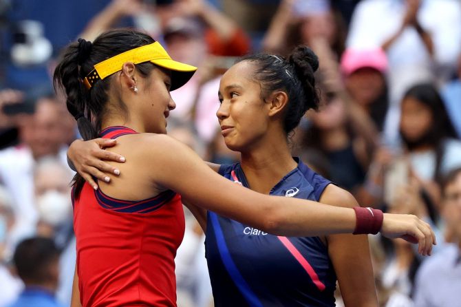 Emma Raducanu, left, and Leylah Fernandez embrace at the end of the final.