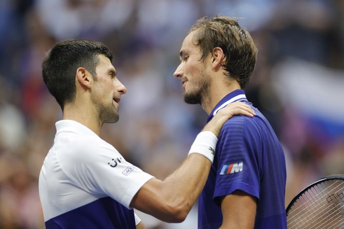 Daniil Medvedev, right, is congratulated by Novak Djokovic at the end of the final.