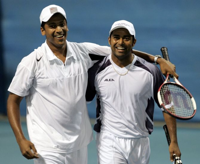 Mahesh Bhupathi and Leander Paes celebrate victory over Zimbabwe's Wayne Black and Kevin Ullyett in the men's doubles quarter-finals at the 2004 Athens Olympics. 