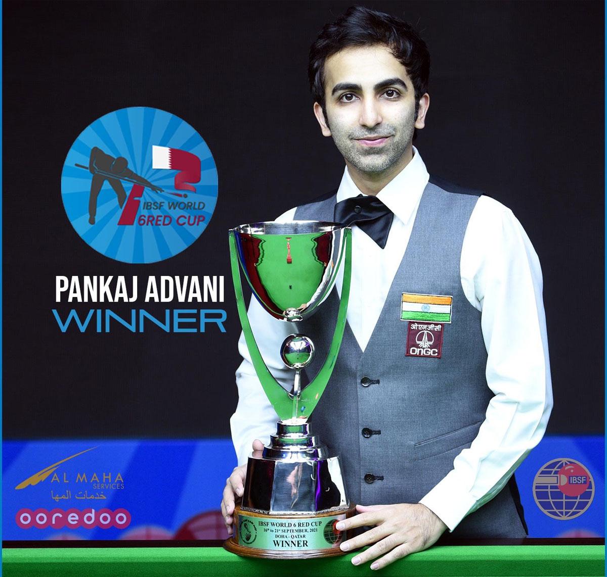 India's Pankaj Advani receives winner's trophy from IBSF President Mubarak Al-Khayarin in Doha on Tuesday.