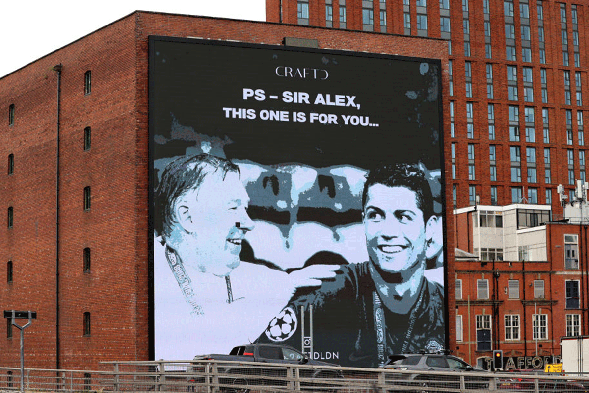 A sign in support of Cristiano Ronaldo of Manchester United and Sir Alex Ferguson is seen outside the Old Trafford stadium prior to the Premier League match between Manchester United and Newcastle United on September 11, 2021 in Manchester, England. 