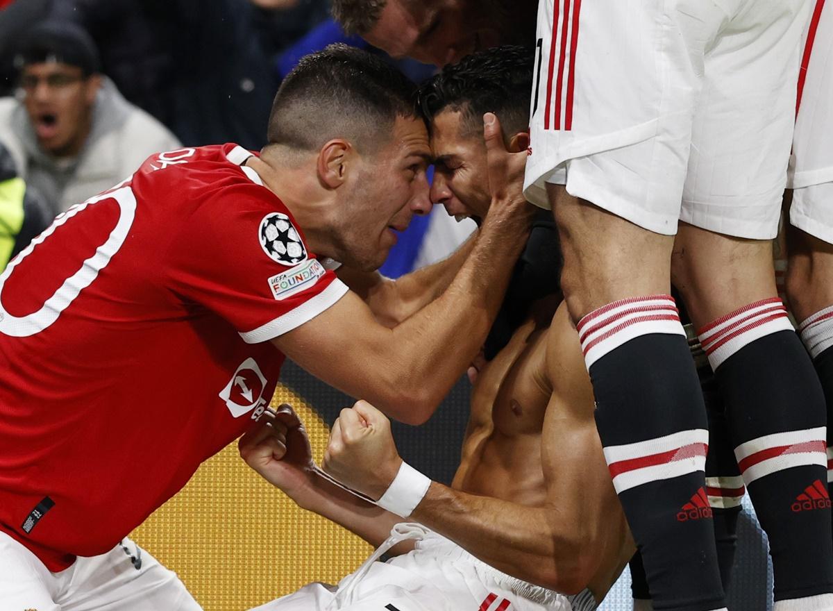 Cristiano Ronaldo celebrates with Diogo Dalot after scoring the match-winner for Manchester United in the Champions League - Group F - match against Villarreal at Old Trafford, on Wednesday.