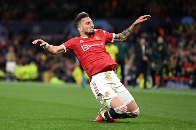 Alex Telles celebrates after restoring parity for Manchester United.