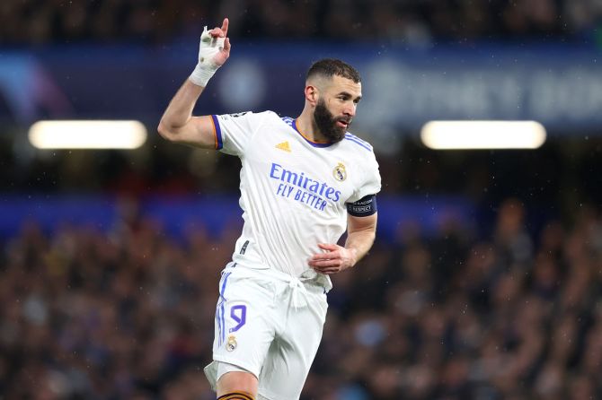 Karim Benzema celebrates scoring Real Madrid's third goal during the Champions League quarter-final first leg against  Chelsea, at Stamford Bridge in London, on Wednesday.