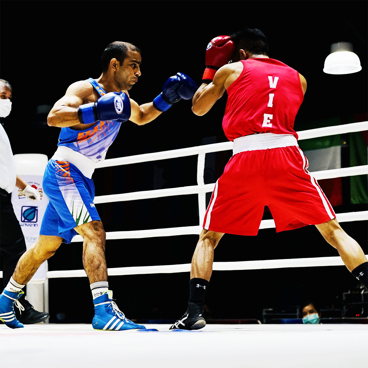 India's Amit Panghal in action against Tran Van Thao of Vietnam during their 54 kg semi-final bout on Friday