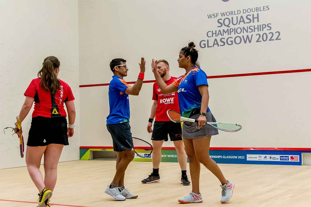 Dipika Pallikal and Saurav Ghosal celebrate a point during their victorious mixed doubles title-winning match at the World Doubles squash championships in Glasgow on Saturday