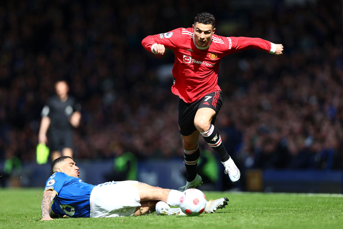 Everton's Allan challenges Manchester United's Cristiano Ronaldo