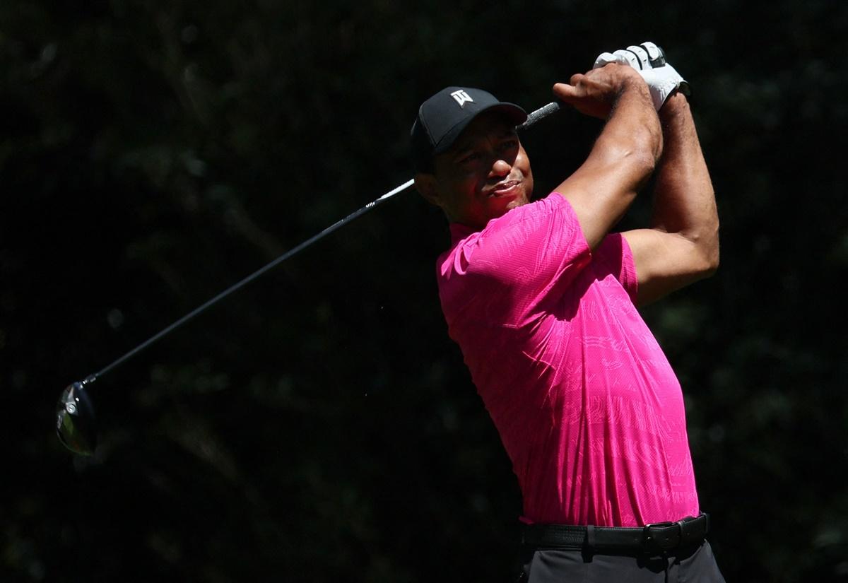 Tiger Woods tees off on the 11th during the first round of the Masters at Augusta National Golf Club - Augusta, Georgia.