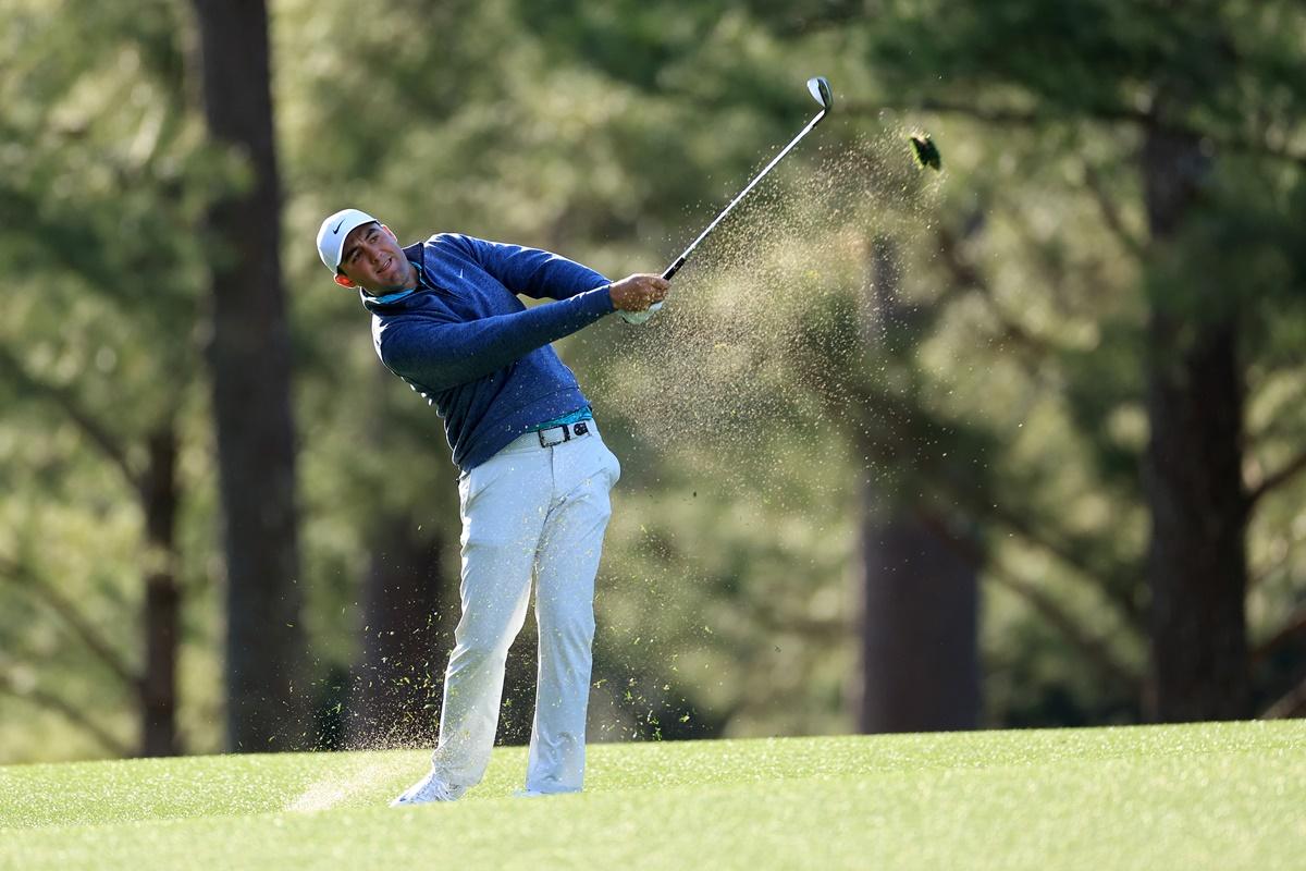 Scottie Scheffler plays his shot on the 14th hole during the third round of the Masters at Augusta National Golf Club in Augusta, Georgia, on Saturday. 