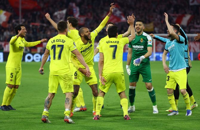 Villarreal players celebrate after snatching a 1-1 draw in the second leg against Bayern Munich and reaching the Champions League semi-finals with a 2-1 aggregate win at the Allianz Arena, in Munich, Germany, on Tuesday.