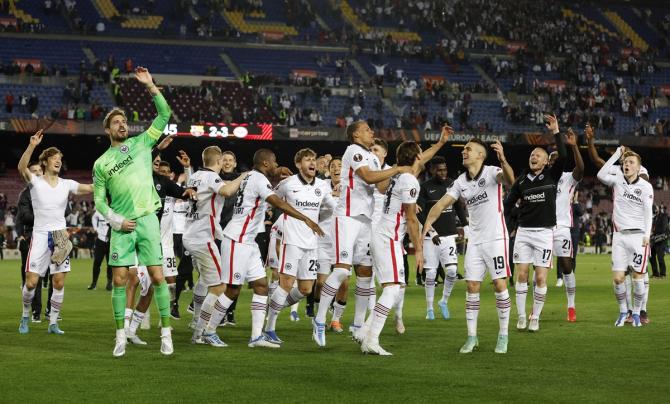 Eintracht Frankfurt players celebrate after beating Barcelona and sealing a place in the semi-finals of the Europa League, at Camp Nou, Barcelona, Spain, on Thursday.