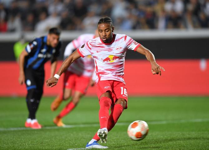 Christopher Nkunku scores RB Leipzig's second goal against Atalanta from the penalty spot, at Stadio Atleti Azzurri, Bergamo, Italy.