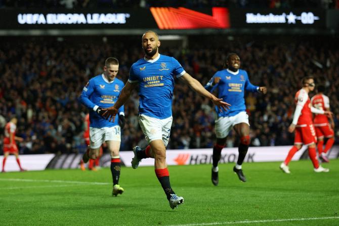 Kemar Roofe celebrates scoring Rangers's third goal against Sporting Braga, at Ibrox Stadium in Glasgow, Scotland.