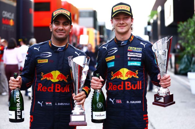 India's Jehan Daruvala, left, of Prema Racing and third placed Dennis Hauger of Norway, also of Prema Racing, pose with their trophies after the Imola Sprint race of the Formula 2 Championship, at Autodromo Enzo e Dino Ferrari in Imola, Italy, on Saturday.