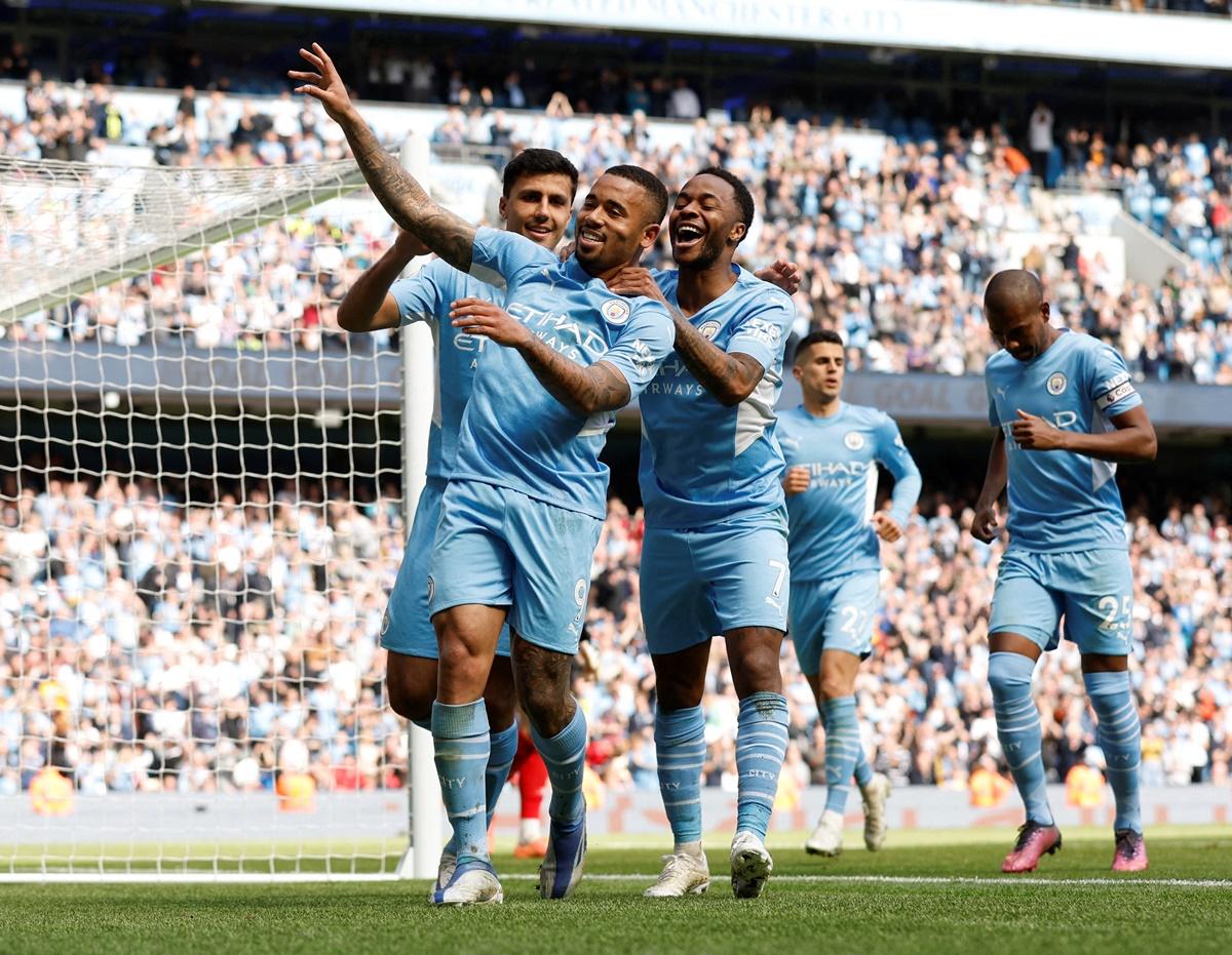 Gabriel Jesus celebrates with teammates after scoring Manchester City's fourth goal to complete his hat-trick in the Premier League match against Watford, at Etihad Stadium, in Manchester, on Saturday.