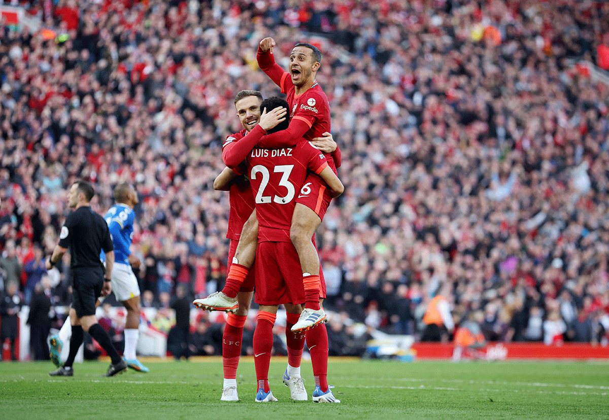 Liverpool's Luis Diaz, Thiago Alcantara and Jordan Henderson celebrate their second goal scored by Divock Origi against Everton at Anfield in Liverpool 