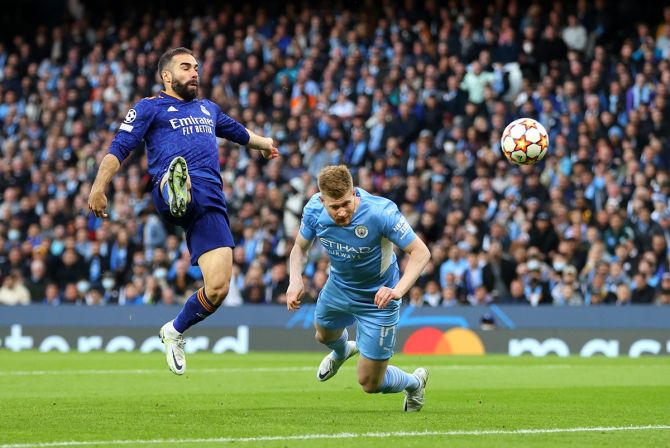 Kevin De Bruyne scores Manchester City's first goal with a diving header during the UEFA Champions League semi-fFinal first leg against Real Madrid, at Etihad Stadium in Manchester, England, on Tuesday.