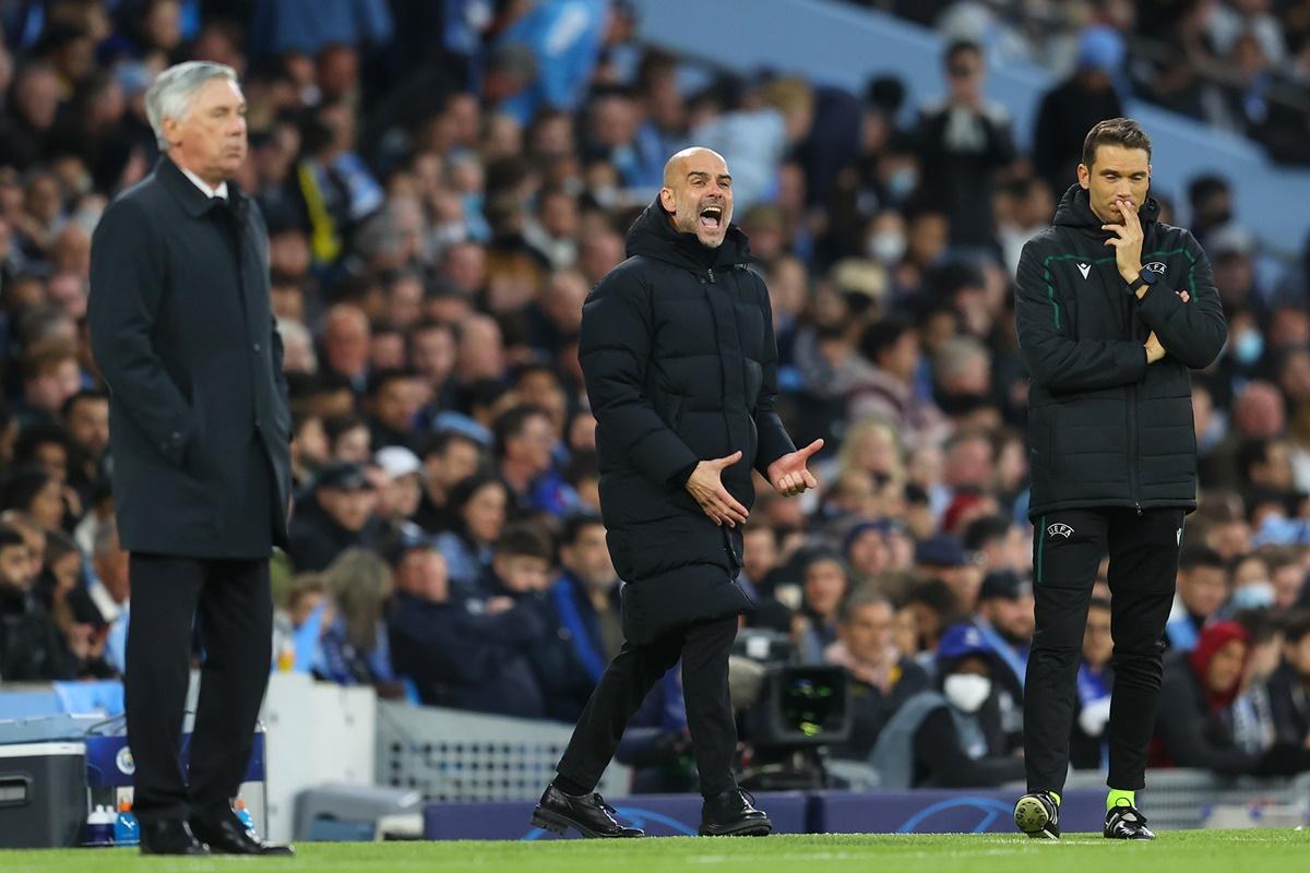 Real Madrid's manager Carlo Ancelotti watches anxiously as Manchester City's manager Pep Guardiola reacts during the UEFA Champions League semi-final first leg. 