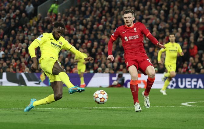 Villarreal's Boulaye Dia and Liverpool's Andrew Robertson battle for possession.