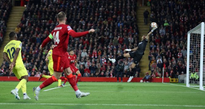 Villarreal's Pervis Estupinan scores an own goal, deflecting a cross from Liverpool's Jordan Henderson past goalkeeper goalkeeper Geronimo Rulli.