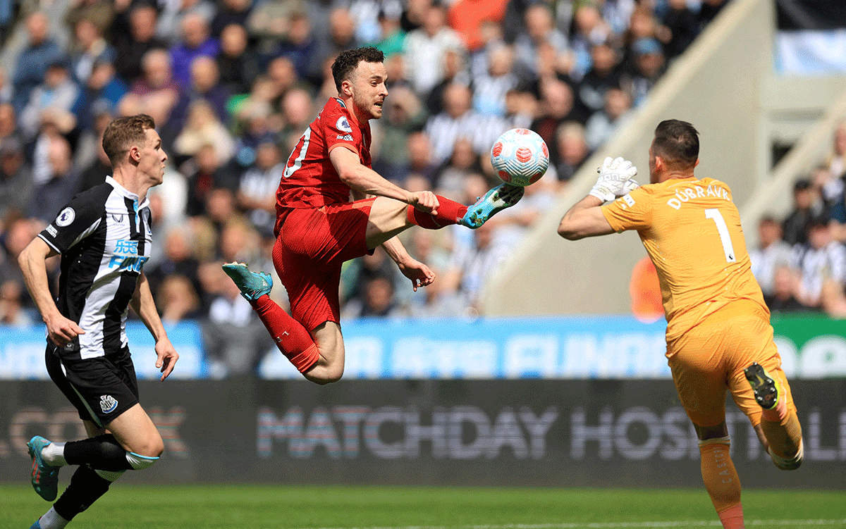 Liverpool's Diogo Jota in action with Newcastle United's Martin Dubravka 