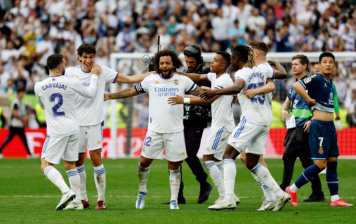 Real Madrid's Marcelo, Eduardo Camavinga, Daniel Carvajal, Jesus Vallejo and teammates celebrate after winning the La Liga