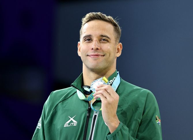 South Africa's Chad Le Clos celebrates on the podium after finishing second in the men's 200 metres butterfly and winning his 18th medal.