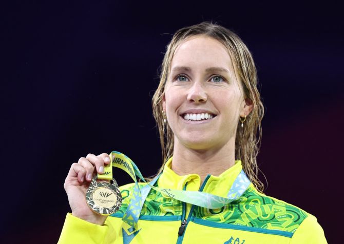 Australia's Emma McKeon celebrates on the podium after winning gold in the women's 50m freestyle at the Commonwealth Games, in Birmingham, on Sunday.