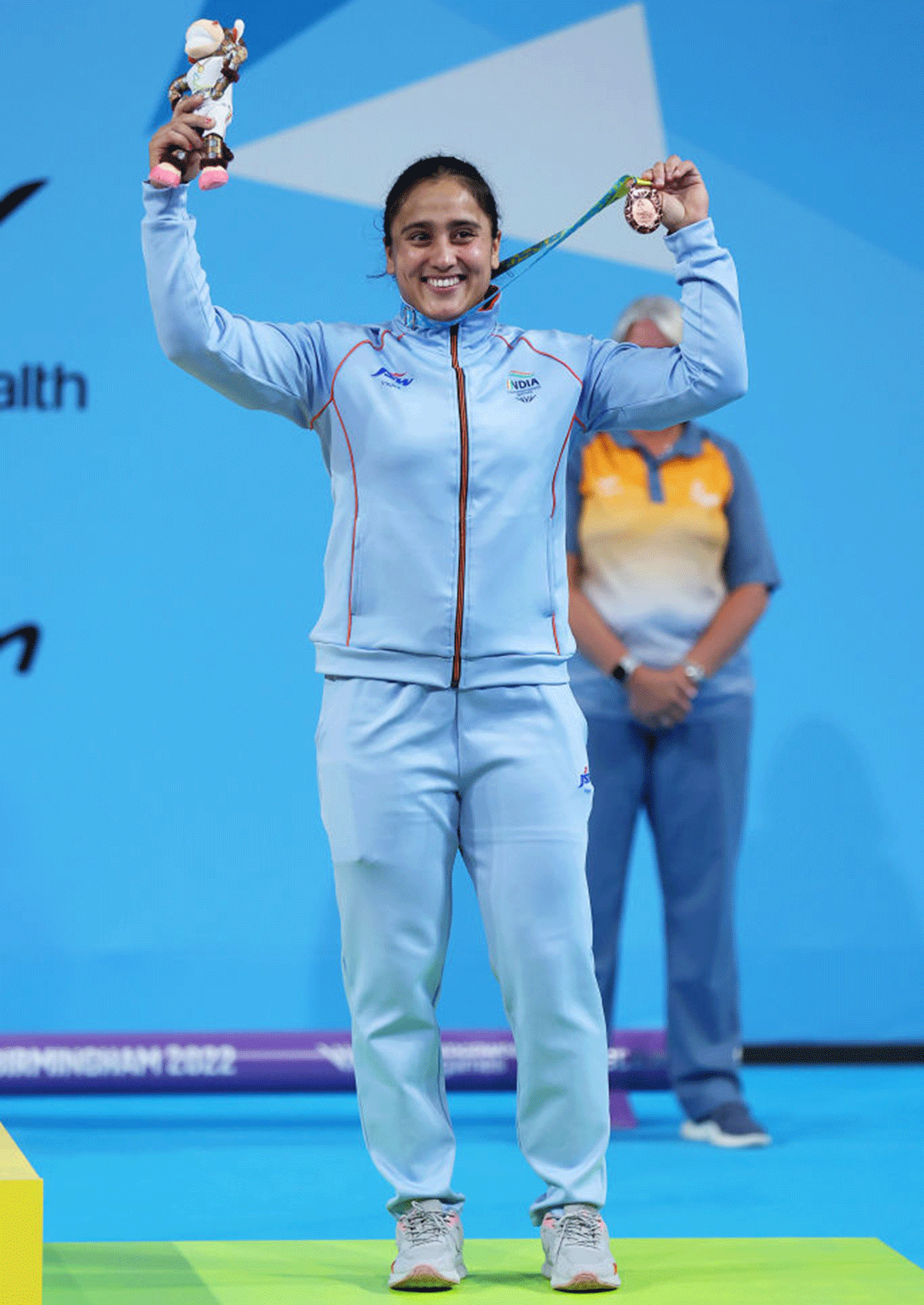 Bronze medallist, India's Harjinder Kaur is all smiles on the podium at the medal ceremony on Day four of the Birmingham 2022 Commonwealth Games at NEC Arena in Birmingham on Monday