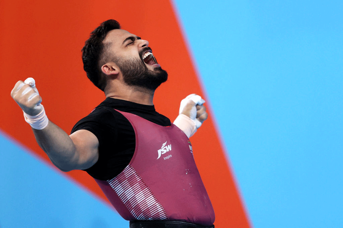 India's Vikas Thakur of Team India celebrates during the Men's Weightlifting 96kg - Final on day five of the Birmingham 2022 Commonwealth Games at NEC Arena in Birmingham on Tuesday
