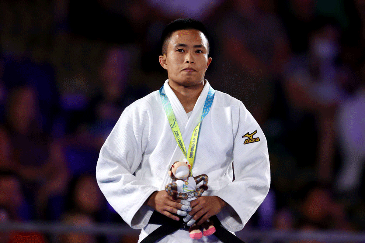 Silver medallist, India's L Shushila Devi celebrates on the podium after her bout in the Judo Women - 48 kg medal ceremony on day four of the Birmingham 2022 Commonwealth Games at Coventry Stadium on Monday