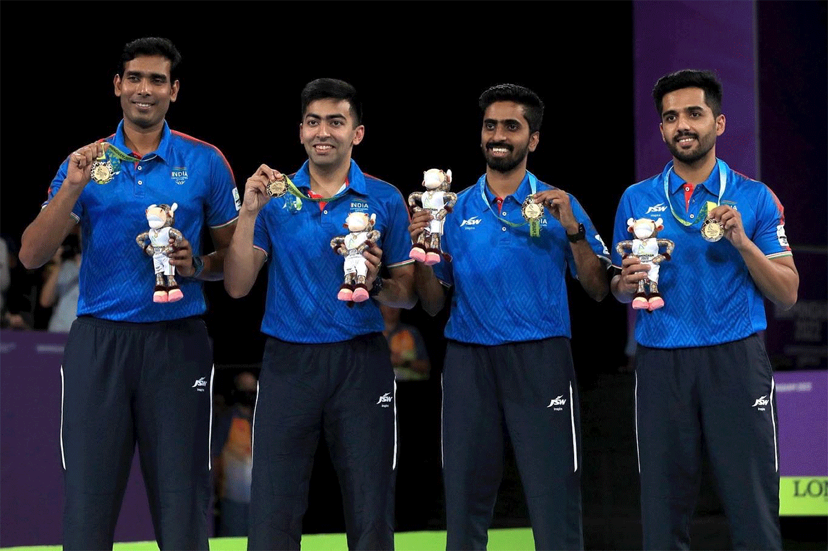The Indian quartet of Sharath Kamal, Harmeet Desai, Sathiyan Gnanasekaran and Sanil Shetty celebrate with their gold medals