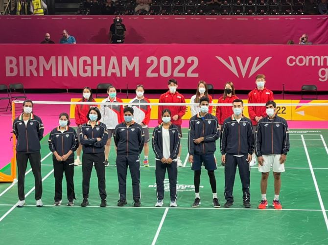 India's mixed badminton team with their silver medal