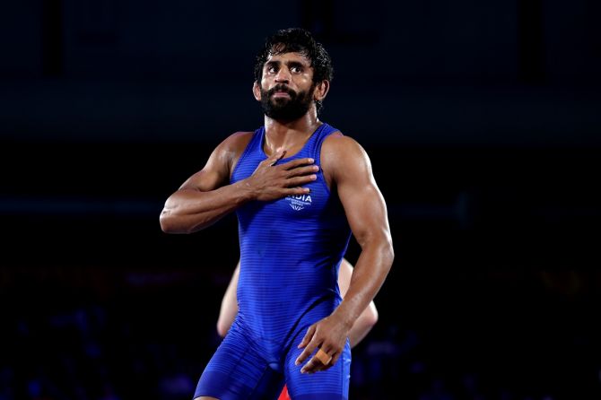 Bajrang Punia celebrates victory over Canada's Lachlan McNeil in the men's freestyle wrestling 65 kg final on Friday, Day 8 of the Birmingham 2022 Commonwealth Games.