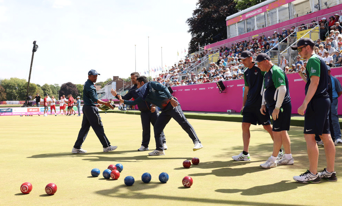 India's Dinesh Kumar, Sunil Bahadur and Navneet Singh  interact during the Men's Fours Gold medal match against Northern Ireland  on day nine of the Birmingham 2022 Commonwealth Games at Victoria Park at the Leamington Spa, England, on Saturday