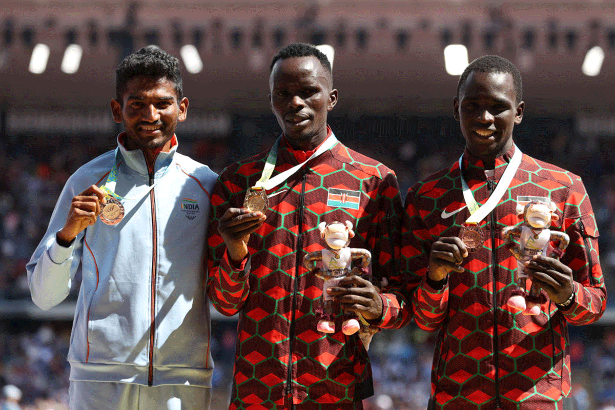 (L-R) Silver medalist, India's Avinash Mukund Sable, gold medalist, Kenya's Abraham Kibiwot and bronze medalist, Kenya's Amos Serem during the medal ceremony for the crosses the Men's 3000m Steeplechase Final on day nine of the Birmingham 2022 Commonwealth Games at Alexander Stadium in Birmingham on Saturday