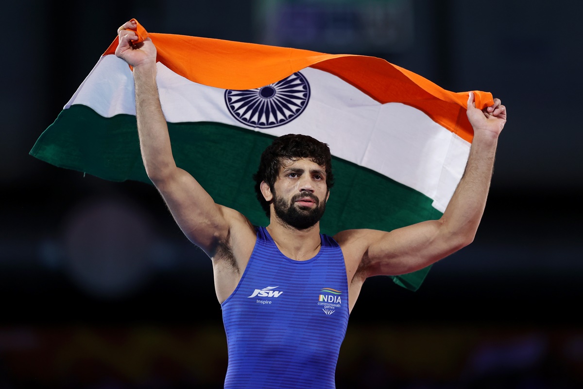 Ravi Dahiya celebrates with Indian flag after defeating Nigeria's Ebikewenimo Welson in the men's Freestyle 57 kg wrestling gold medal match on Day 9 of the Birmingham 2022 Commonwealth Games on Saturday.