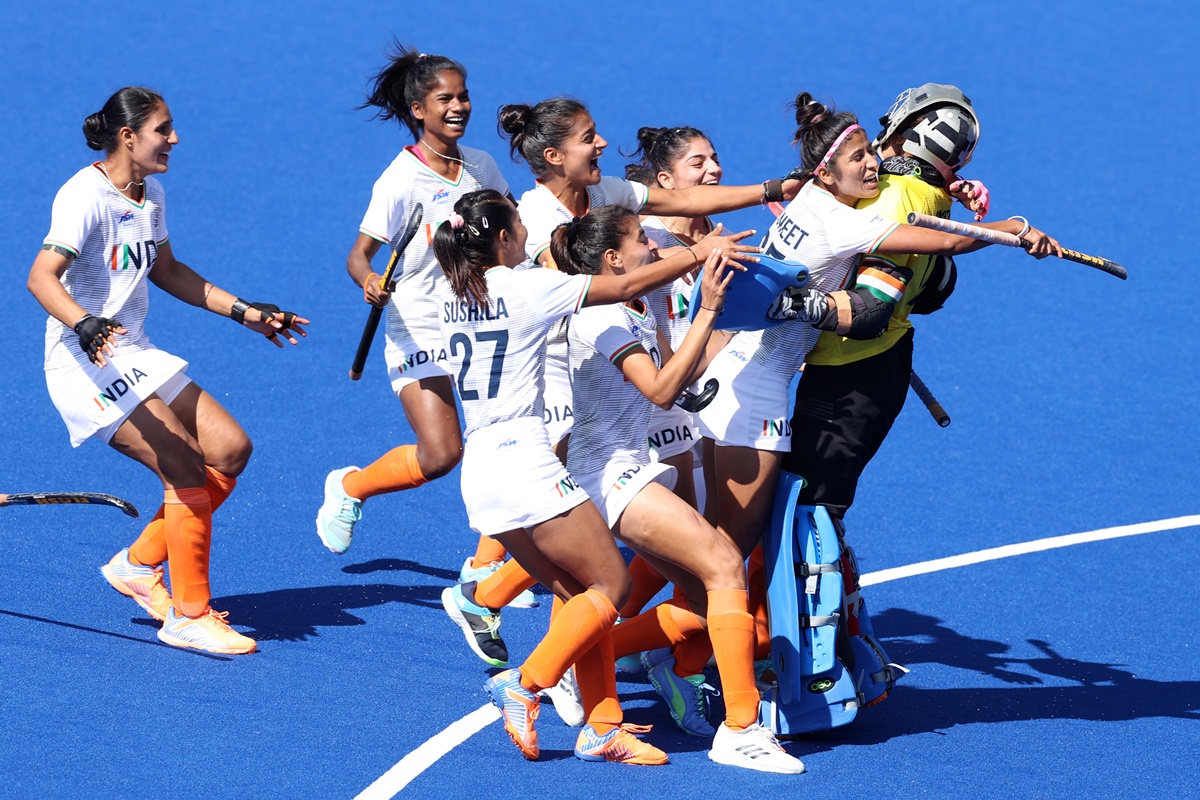 India's players celebrate with skipper-goalkeeper Savita Punia after beating New Zealand in the bronze medal play-off at the Commonwealth Games, in Birmingham, on Sunday