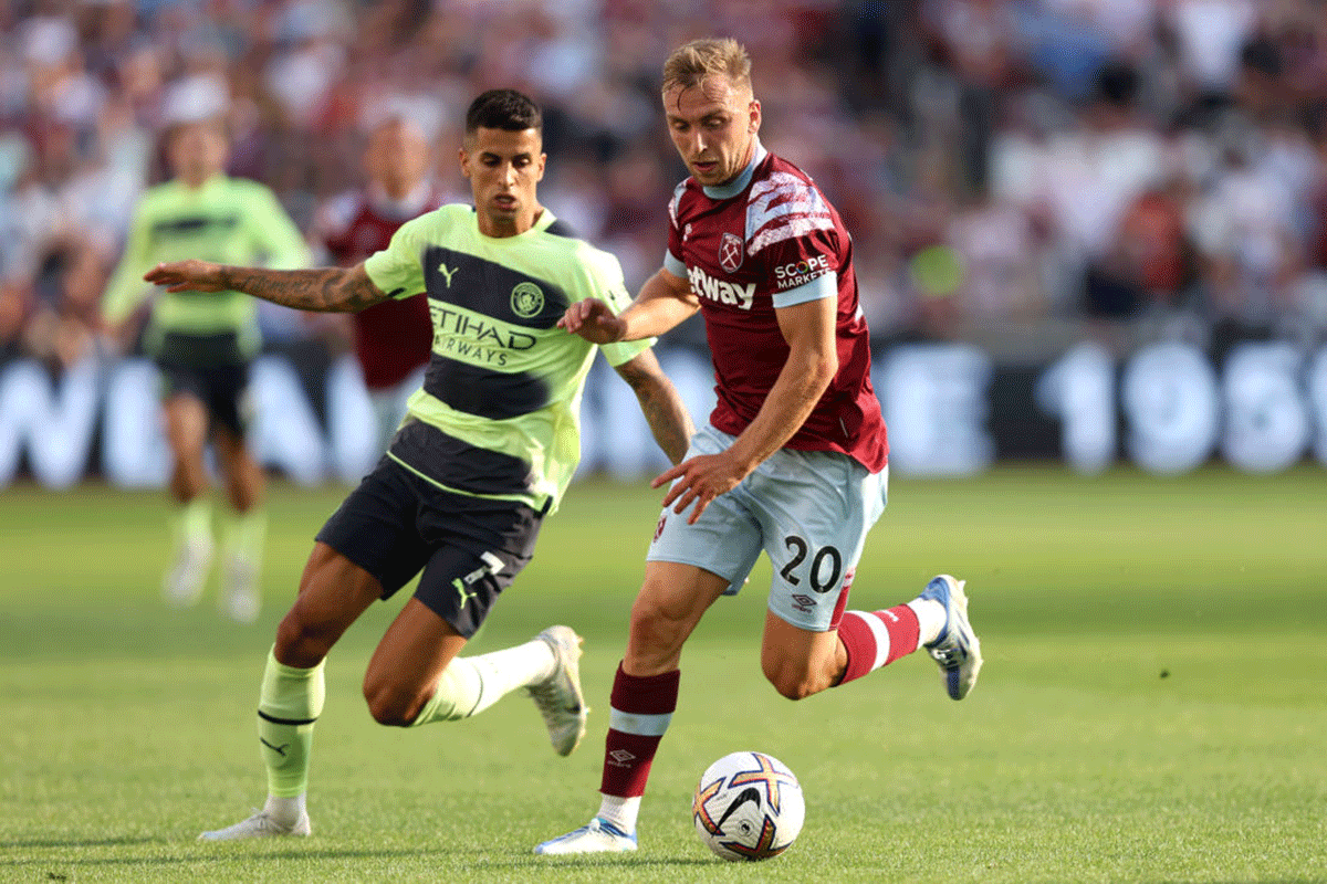 West Ham United's Jarrod Bowen and Manchester City's Joao Cancelo battle for the ball