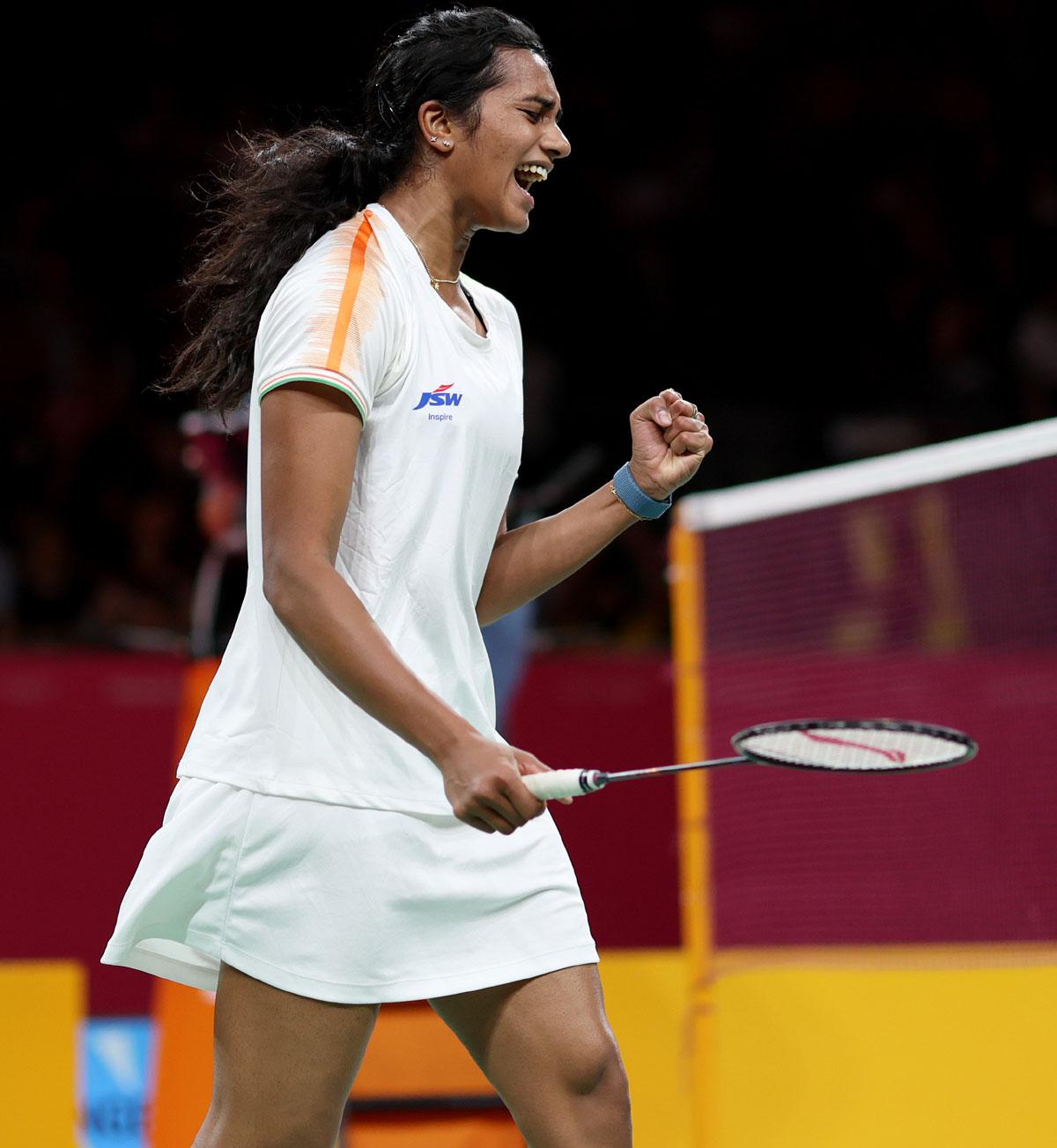 P V Sindhu celebrates winning the first game against Michelle Li. 