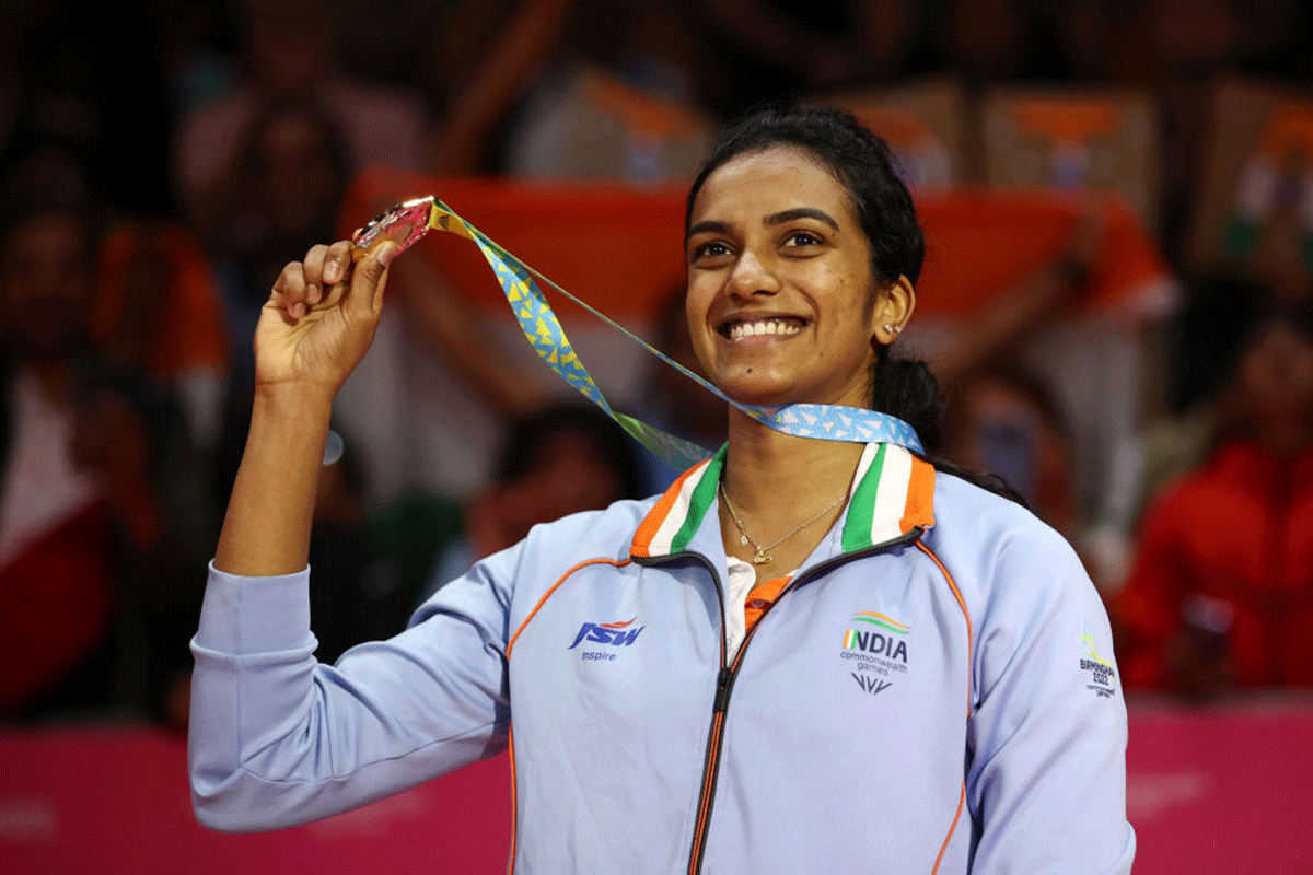 Gold medalist, P V Sindhu celebrates on the podium during the Badminton Women's Singles medal ceremony on Monday