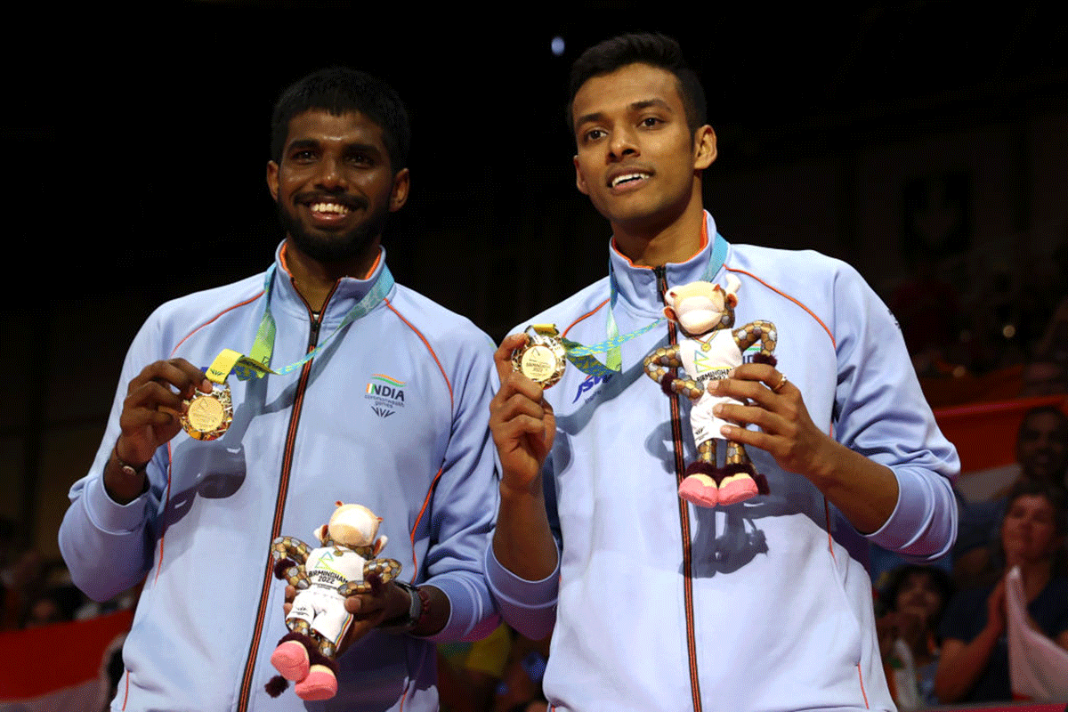 Gold medalists, India's Satwiksairaj Rankireddy and Chirag Shetty during the medal ceremony for the Badminton Men's Doubles on day eleven of the Birmingham 2022 Commonwealth Games at NEC Arena in Birmingham on Monday